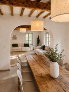 a living room with a large wooden table and chairs at Tenuta Seriole in Poppi