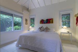 
A bed or beds in a room at Maris Paraty

