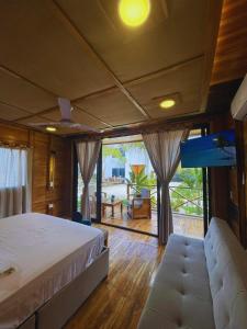 a bedroom with a large bed and a large window at Oasis Manzanillo Del Mar in Manzanillo del Mar +29 photos