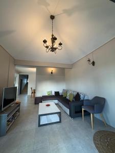 a living room with a couch and a table at Vanz Villa in Mont Choisy