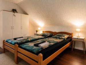 a bedroom with a large bed in a room at Holiday Home Alen - Una National Park Retreat - with Garden & Terrace in Kulen Vakuf