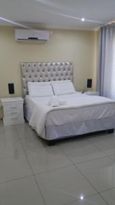 Munisa Guest House tesisinde bir odada yatak veya yataklar
