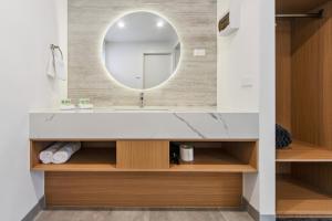a bathroom with a sink and a mirror at Frankston Bay Motel in Frankston +39 photos