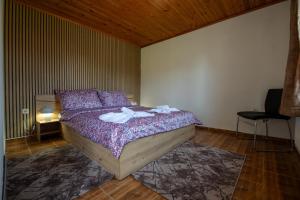 a bedroom with a bed with towels on it at Вила Рай in Elena +32 photos