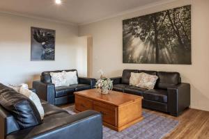 a living room with two couches and a coffee table at Cockatoo Lodge - Winery Retreat at Rivendell Estate in Yallingup Siding +40 photos