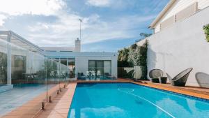 a swimming pool in the backyard of a house at Blissful Escape in Portsea