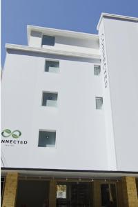 a white building with a sign on it at Connected Hotel Nonhyeon in Seoul