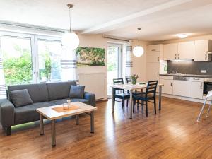 a living room with a couch and a table at Ferienhof Häckler in Ochsenhausen
