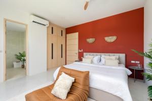 a bedroom with a large bed and a couch at Modern Jungle Pool Villa in Mae Nam +28 photos