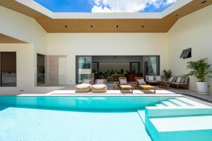 a swimming pool in a house at Modern Jungle Pool Villa in Mae Nam