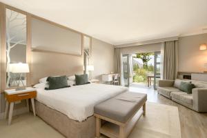 a bedroom with a large bed and a living room at Stellenbosch Luxury Apartments in Stellenbosch +204 photos