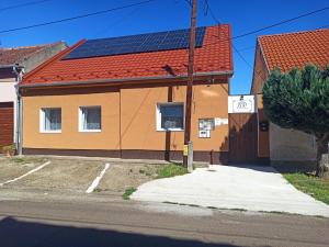 a house with solar panels on its roof at B30 Apartmanok, Eger in Eger
