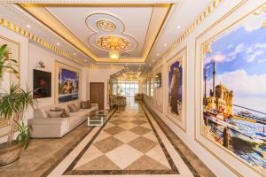 a living room with paintings on the walls at Harmony Hotel Merter & SPA in Istanbul