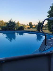 a view of a swimming pool from a boat at Domaine Bel Air 855 - Gîte Belle in Saint-Denis-de-Villenette