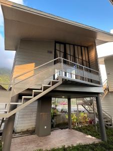 a house with a staircase on the side of it at Beji Bedugul Glamping in Bedugul