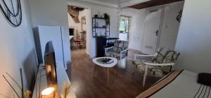 a living room with a table and chairs at Filich Home Experience in Labin +18 photos