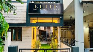 a building with a sign that reads elite boutique stays at Elite Boutique Stays in Ujjain