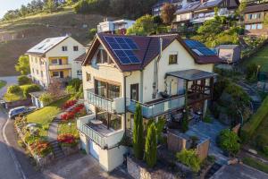 a house with solar panels on its roof at Ferienwohnung Habermehl in Oppenau