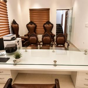 an office with chairs and a desk with a mirror at The Crown Resort in Sonīpat +20 photos