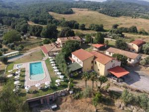 an aerial view of a house with a swimming pool at Il Bettarello in Roccastrada