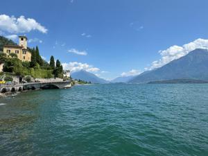 a view of a lake with mountains in the background at The Secret Lakeside in Gravedona