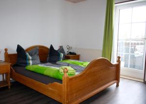 Postel nebo postele na pokoji v ubytování Pension Finkenschenke