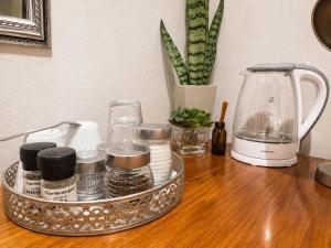 a tray of cosmetics sitting on a table with a blender at Tree Aloe Guest House in Mokopane