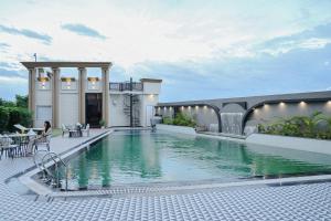 a swimming pool in the middle of a house at Bedi's Dream Land Hotel & Resort in Ayodhya