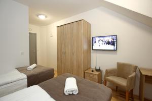 TV a/nebo společenská místnost v ubytování Gostilna in prenočišča Gedžo