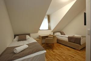 Postel nebo postele na pokoji v ubytování Gostilna in prenočišča Gedžo