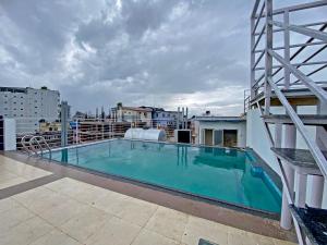 a large swimming pool on the roof of a building at Shine Boutique Hotel in Kathmandu