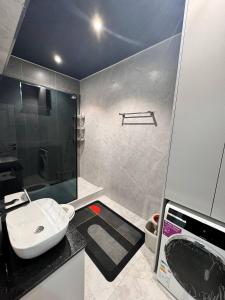 a bathroom with a sink and a shower at Apartment Samarkand in Samarkand