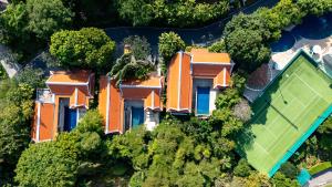 an aerial view of a house with a yard at Katamanda B2 Tropical Pool Villa Kata Beach in Kata Beach