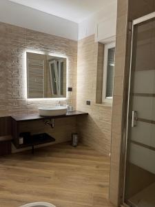 a bathroom with a sink and a mirror at Villa Celeste in Pulsano +31 photos