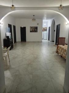 a large living room with a large tile floor at Rooms New DiamonD in Durrës
