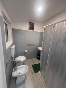 a bathroom with a shower and a toilet and a sink at Dal barone in Capo dʼOrlando