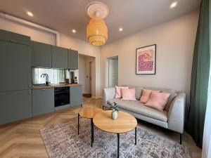 a living room with a couch and a table at Jakobsoni 15 Apartmendid in Viljandi