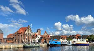a group of boats are docked in a harbor at Dat Kleenood in Wismar