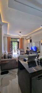 a living room with a couch and a table at Legacy Homes in Dar es Salaam