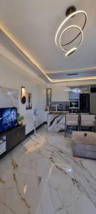 a large living room with a large marble floor at Legacy Homes in Dar es Salaam