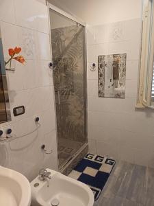 a bathroom with a shower and a sink at A due passi dal mare in Ribera