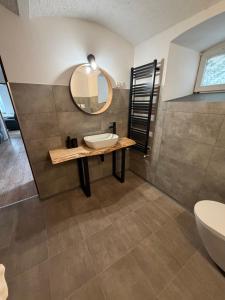 a bathroom with a sink and a mirror at Chata na Karpackiej in Kostrzyca +27 photos