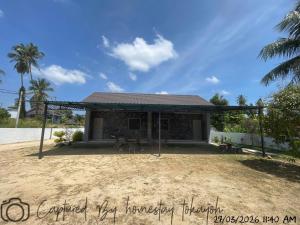 a house with a pavilion on a beach at Homestay Studio TOKAYOH in Kota Bharu