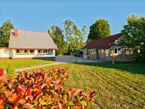 a house and a yard with a building at Liki Niki Spa in Gospić