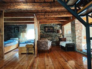 a bedroom with a bed and a fireplace in it at Liki Niki Spa in Gospić +85 photos