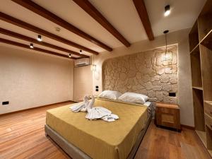 a bedroom with a bed with towels on it at Naama Lofts in Sharm El Sheikh +43 photos
