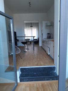 a living room with a table and a kitchen at apartment Amsterdamstr 1st fl in Ostend