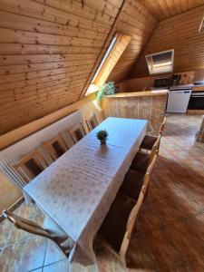 a dining room with a table and some chairs at Berni apartman in Badacsonytomaj +31 photos