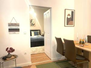 a room with a desk and a room with a bedroom at Museums Quartier 0608 in Vienna