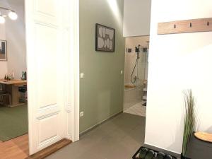 a hallway with a bathroom with a shower at Museums Quartier 0608 in Vienna